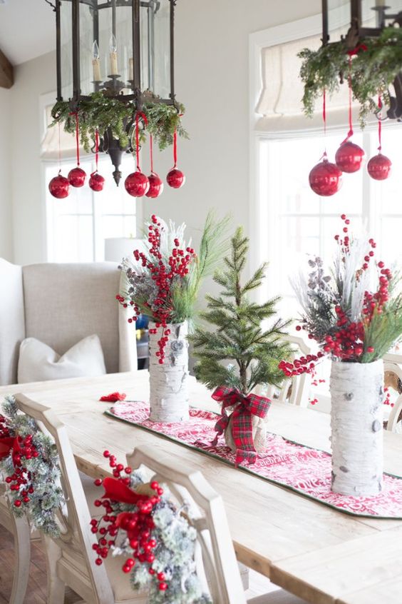 rock red ornaments and evergreen branches