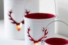 34 white tin can lanterns with red inner side and deer cutouts