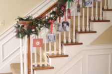 36 hanging cards on an evergreen garland with some ribbon