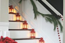 36 red lanterns placed on the stairs and an evergreen garland