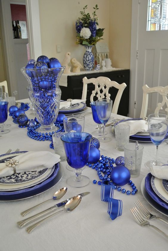 royal blue beads, ornaments and chargers for table decor