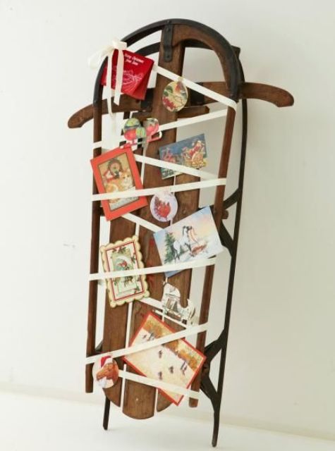 a vintage sleigh display with ribbon