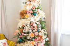 a gorgeous floral Christmas tree with dried fronds, grasses and lights plus a pink faux fur skirt is a very bold and jaw-dropping idea