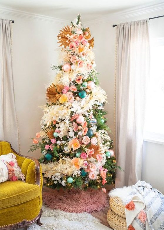 A gorgeous floral Christmas tree with dried fronds, grasses and lights plus a pink faux fur skirt is a very bold and jaw dropping idea
