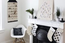 black and white stockings, black garlands, an advent calendar and black and white pillows