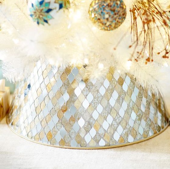 make your tree shimmering with this handcrafted tree collar featuring hand-laid mirrors in gold and silver tones