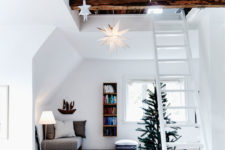 01 This modern Danish loft with double ceilings has a truly Scandinavian look and is decorated for the winter holidays