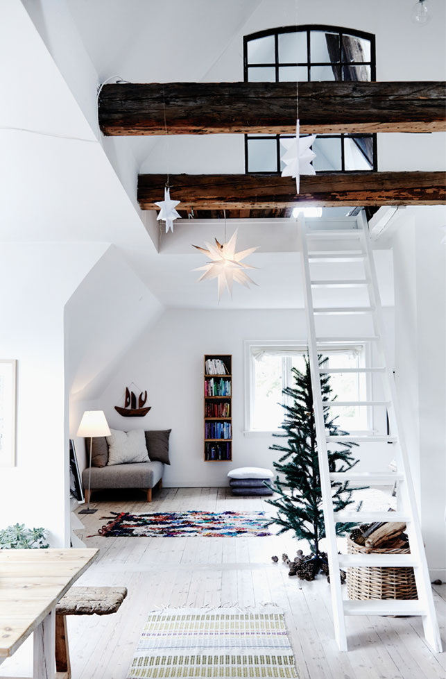 This modern Danish loft with double ceilings has a truly Scandinavian look and is decorated for the winter holidays