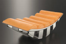 01 This refined lounger is done in orange leather and inspired by military aircrafts