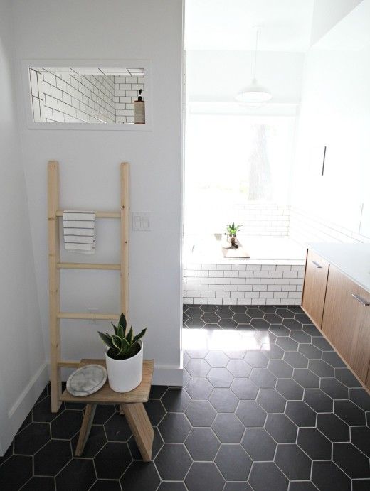 black hex tiles and white grout and white subway tiles with black grout