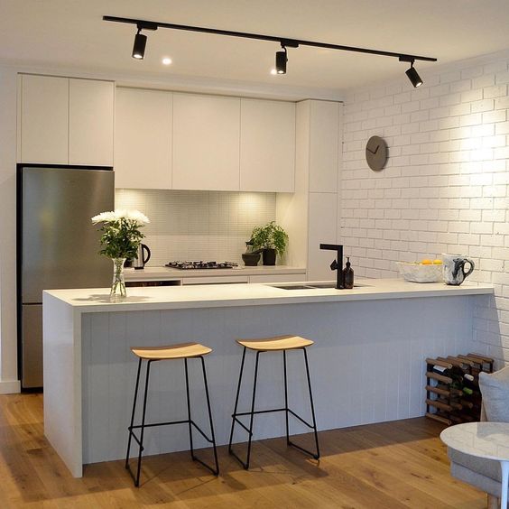 a couple of track lights will accentuate your kitchen island easily