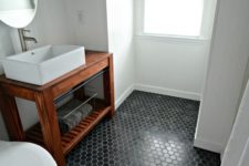 03 black hex tiles make a statement in this neutral bathroom
