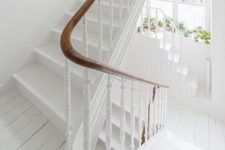 03 clean white staircase for a shabby chic feel and warm wooden handrail