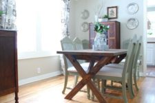 03 dark-stained wooden table and aqua-colored chairs