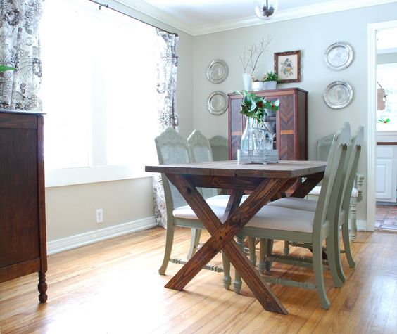 Dark stained wooden table and aqua colored chairs