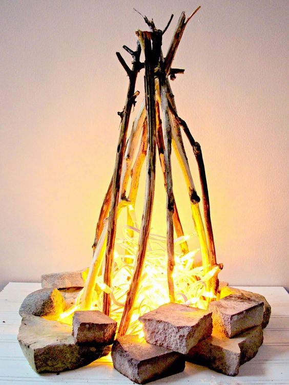flameless fire pit with string lights can be recreated inside without any problems