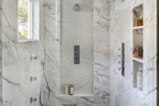 03 marble walk-in shower with a different floor and built-in shelves