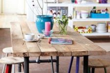 04 indoor picnic table with industrial pipe legs and a warm wood tabletop