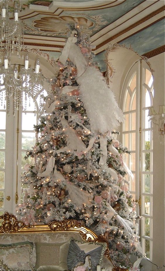 large Christmas tree decorated in white and pink, faux fur and garlands
