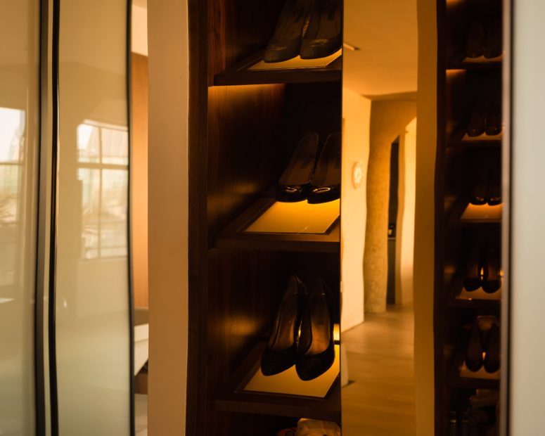 The closets are clad with American walnut