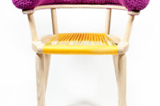06 This chair boasts of a purple knit back and a yellow string seat