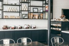 06 industrial-styled coffee shop with metal furniture and dark metal shelves