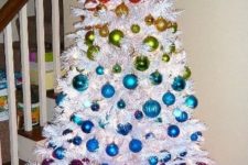 06 such colorful ornaments look amazing on a crispy white tree and stand out even more