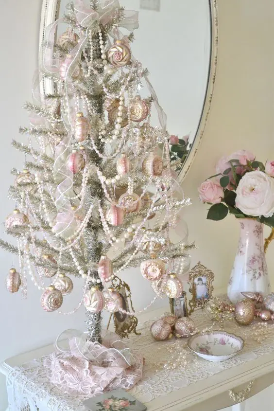 unique silver tabletop tree with white beads and pink ornaments