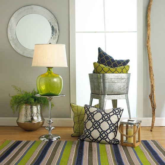 a greenery glass lamp and a striped rug with this color