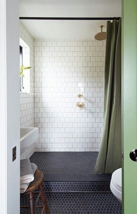 navy hex tiles on the shower and bathroom floor