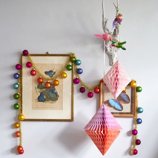 colorful Christmas ornament garland and paper decorations