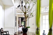 11 highlight your double height windows with lime green curtains