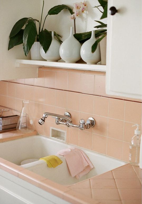 salmon pink tiles on the backsplash and countertops