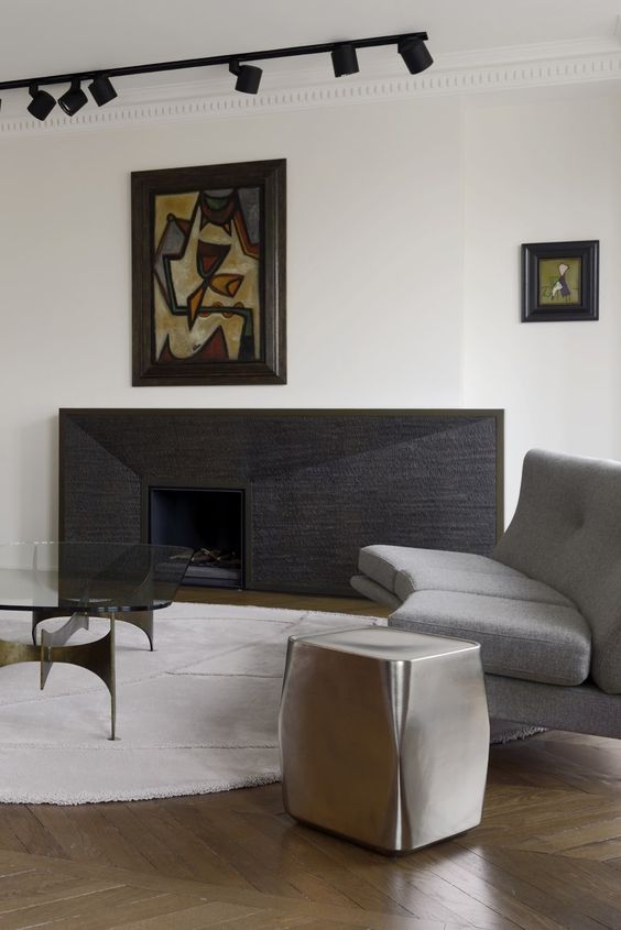 refined modern living room with track lights to accentuate artworks