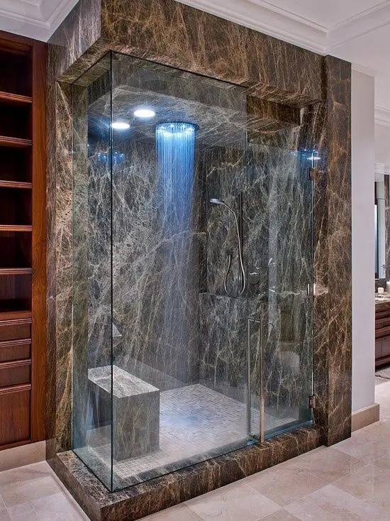 modern dark marble shower and a bench to enjoy the steam