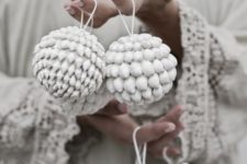 14 whitewashed shell ornaments look very boho-like
