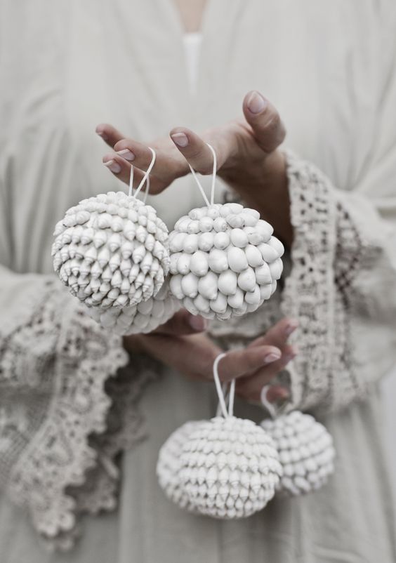 Whitewashed shell ornaments look very boho like