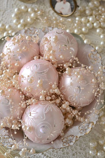 a chic bowl with pearls and pastel pink ornaments is a cool delicate display
