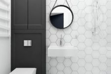 16 white hex tiles with black grout to highlight it and large square tiles on the floor