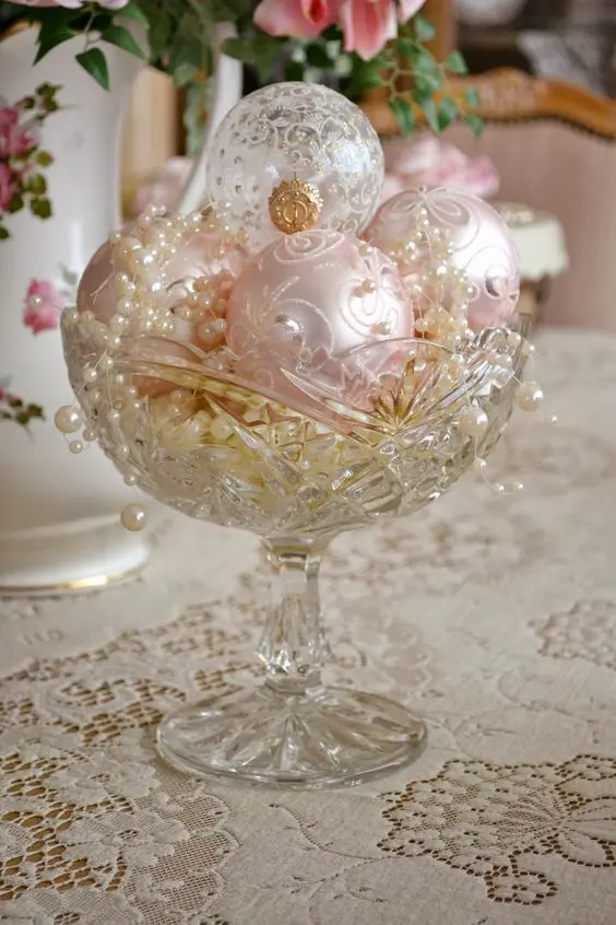 antique crystal bowl with pink and ivory ornaments and pearls