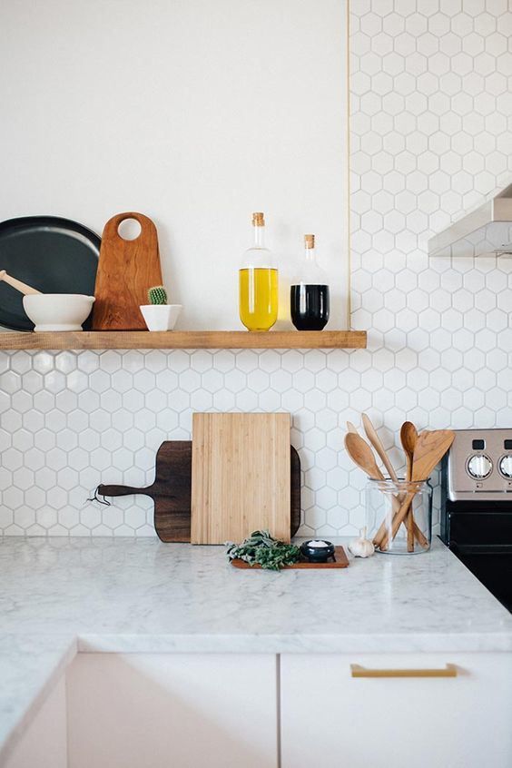 marble small hexagon tiles and a marble countertop look harmonious together