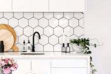 18 white hex tile backsplash with black grout to fit the decor