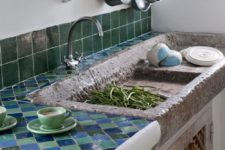 19 green and blue tiles on the backsplash and countertop