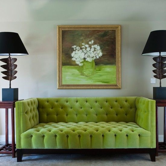 upholstered lime sofa contrasts with black lamps