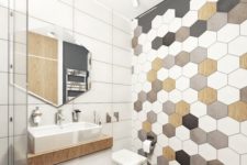21 hex tiles mosaics on the wall and wooden floors make the bathroom hoht