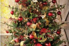 21 lush tree in a box with red ornaments, gold and green deco mesh and garlands