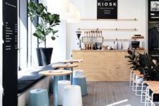 21 modern coffee shop with whitewashed floors, black accents and pastel touches