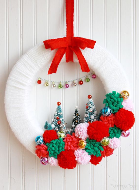 winter wonderland Christmas wreath with pompoms and bottle brush trees