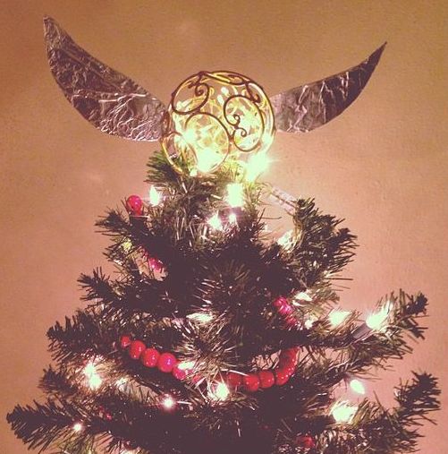lit up Golden Snitch Christmas tree topper