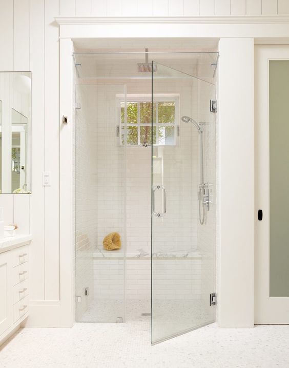 all-white bathroom and steam room with a shower